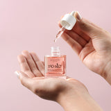 hands holding face elixir